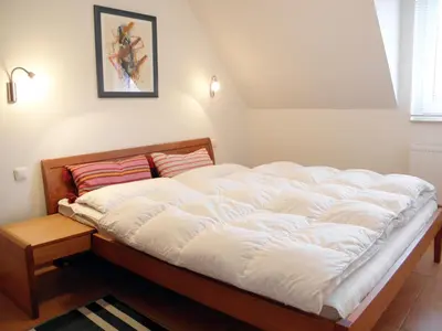 Ein Bett oder Betten in einem Zimmer der Unterkunft Glebbe 17 Wohnung 4
