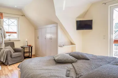 Ein Bett oder Betten in einem Zimmer der Unterkunft MIN SÜNN im Grünen Winkel