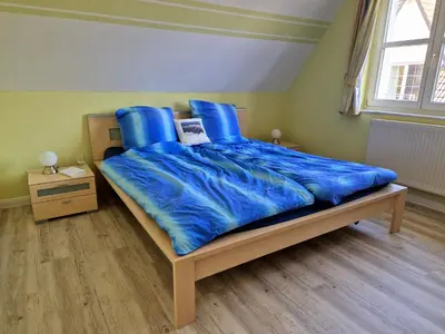 Ein Bett oder Betten in einem Zimmer der Unterkunft Kranichrast 1 Wohnung 3
