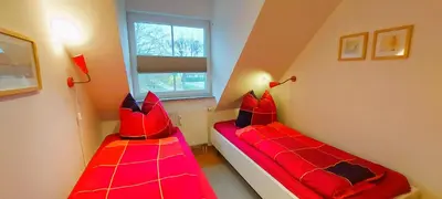 Ein Bett oder Betten in einem Zimmer der Unterkunft Neue Reihe 17 Wohnung Abendsonne