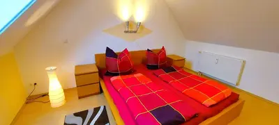 Ein Bett oder Betten in einem Zimmer der Unterkunft Neue Reihe 17 Wohnung Abendsonne