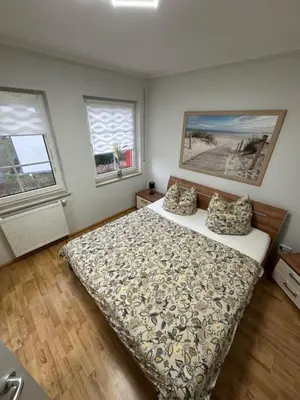 Ein Bett oder Betten in einem Zimmer der Unterkunft Friedenstraße 5 Wohnung Rotbuche