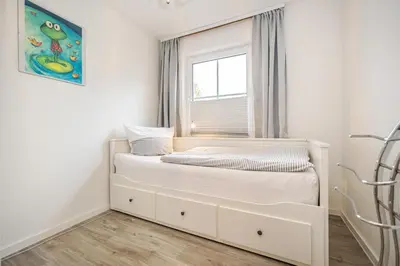 Ein Bett oder Betten in einem Zimmer der Unterkunft Störtebekerstrasse 10b Wohnung 2