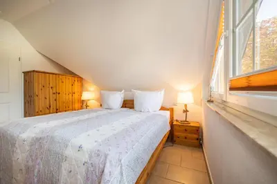 Ein Bett oder Betten in einem Zimmer der Unterkunft Strandstrasse 54c d Wohnung 9