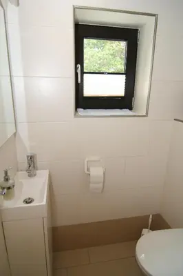 Ein Badezimmer in der Unterkunft Kirchweg 14 Hus Pila