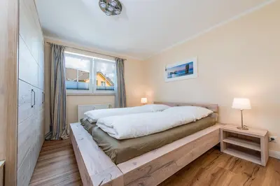 Ein Bett oder Betten in einem Zimmer der Unterkunft Hafenstrasse 22 Wohnung 2 Muschelsucher