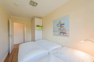 Ein Bett oder Betten in einem Zimmer der Unterkunft Hafenstrasse 22 Wohnung 2 Muschelsucher