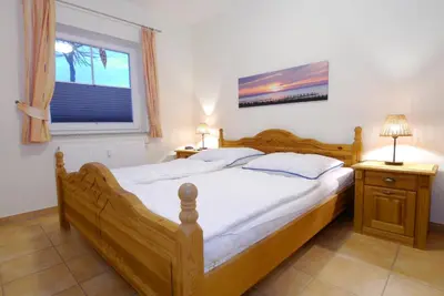 Ein Bett oder Betten in einem Zimmer der Unterkunft Neue Reihe 17 Wohnung 4