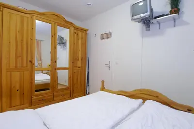 Ein Bett oder Betten in einem Zimmer der Unterkunft Neue Reihe 17 Wohnung 4