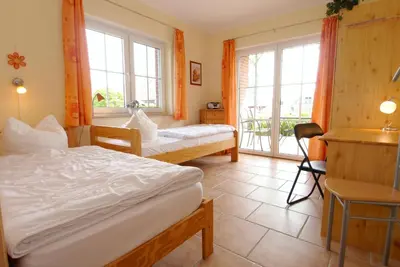 Ein Bett oder Betten in einem Zimmer der Unterkunft Waldstrasse 15 Haus Seepferdchen