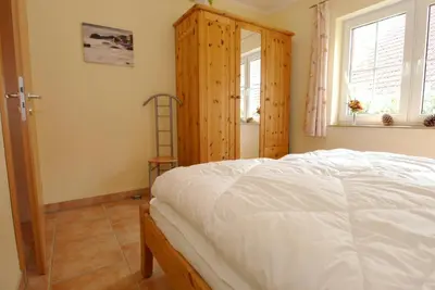 Ein Bett oder Betten in einem Zimmer der Unterkunft Waldstrasse 15 Haus Seepferdchen