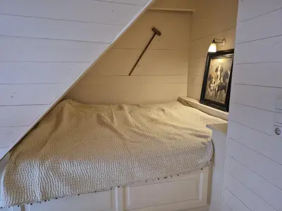 Ein Bett oder Betten in einem Zimmer der Unterkunft Boddenhaus