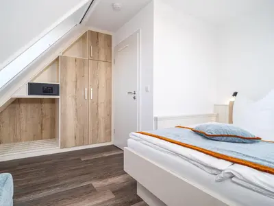 Ein Bett oder Betten in einem Zimmer der Unterkunft Tom's Hof Ferienwhg Alex