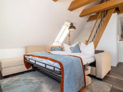 Ein Bett oder Betten in einem Zimmer der Unterkunft Tom's Hof Ferienwhg Alex