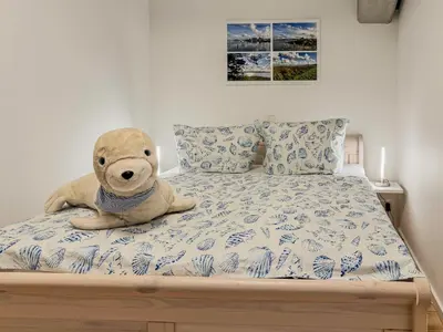Ein Bett oder Betten in einem Zimmer der Unterkunft Speicherresidenz App 2 3 - Wasserblick