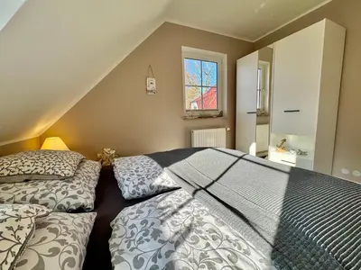 Ein Bett oder Betten in einem Zimmer der Unterkunft Haus Vier-Jahreszeiten