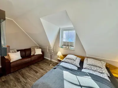 Ein Bett oder Betten in einem Zimmer der Unterkunft Haus Vier-Jahreszeiten