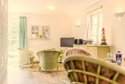 TV/Unterhaltungsangebot in der Unterkunft Achtern Diek Haus 12a Wohnung 4