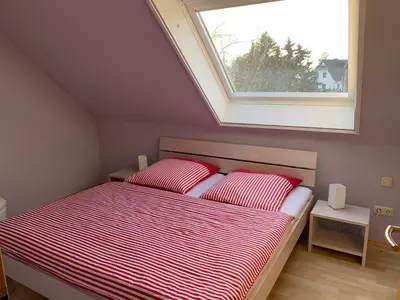 Ein Bett oder Betten in einem Zimmer der Unterkunft Boddenblick 3B