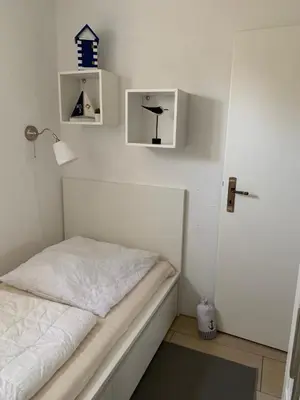 Ein Bett oder Betten in einem Zimmer der Unterkunft Fewo 2, Achtern Diek 3a Zingst