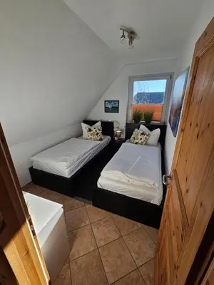 Ein Bett oder Betten in einem Zimmer der Unterkunft Kapitänshaus - Wolkenstube