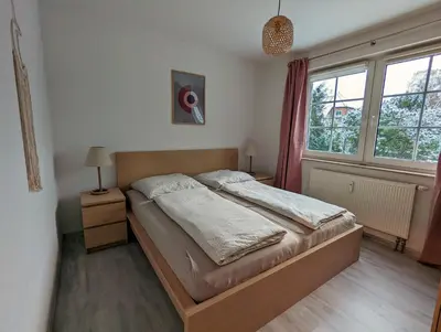 Ein Bett oder Betten in einem Zimmer der Unterkunft Bahnhofstr 11 Haus 2 Whg 3