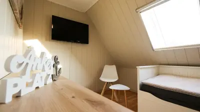 Ein Bett oder Betten in einem Zimmer der Unterkunft Poolaris - Modernes Ferienhaus mit Whirlpool