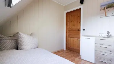 Ein Bett oder Betten in einem Zimmer der Unterkunft Poolaris - Modernes Ferienhaus mit Whirlpool