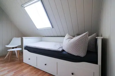 Ein Bett oder Betten in einem Zimmer der Unterkunft Poolaris - Modernes Ferienhaus mit Whirlpool