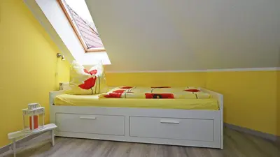 Ein Bett oder Betten in einem Zimmer der Unterkunft Ferienwohnung Genz Zingst