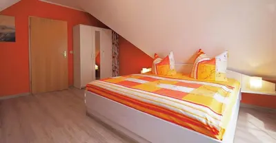 Ein Bett oder Betten in einem Zimmer der Unterkunft Ferienwohnung Genz Zingst