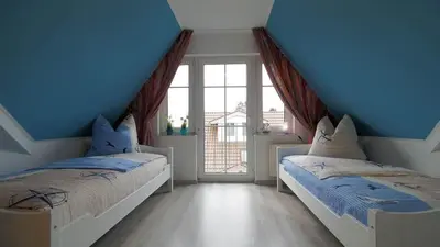 Ein Bett oder Betten in einem Zimmer der Unterkunft Ferienwohnung Genz Zingst