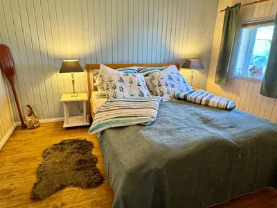 Ein Bett oder Betten in einem Zimmer der Unterkunft Meridiamus 1 - Ferienhäuschen in Boddennähe