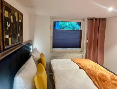 Ein Bett oder Betten in einem Zimmer der Unterkunft Wiesenau 2 Apartment in Prerow by Restaurant Wiesenau