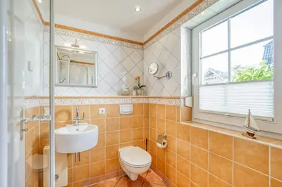 Ein Badezimmer in der Unterkunft Hoppenberg 22 Whg 1