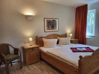 Ein Bett oder Betten in einem Zimmer der Unterkunft Ferienwohnung Vera