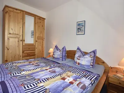 Ein Bett oder Betten in einem Zimmer der Unterkunft Ferienhaus mit Garten in Zingst