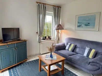 Ein Sitzbereich in der Unterkunft Ferienhaus mit Garten in Zingst