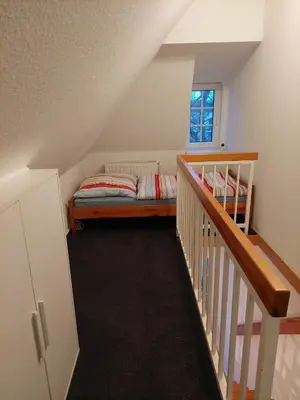 Ein Bett oder Betten in einem Zimmer der Unterkunft Neue Reihe 10 - moderne Ferienwohnung für 5 Personen