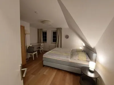 Ein Bett oder Betten in einem Zimmer der Unterkunft Neue Reihe 10 - moderne Ferienwohnung für 5 Personen