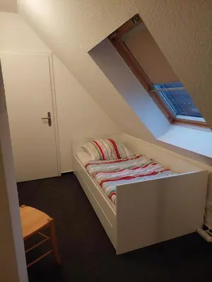 Ein Bett oder Betten in einem Zimmer der Unterkunft Neue Reihe 10 - moderne Ferienwohnung für 5 Personen