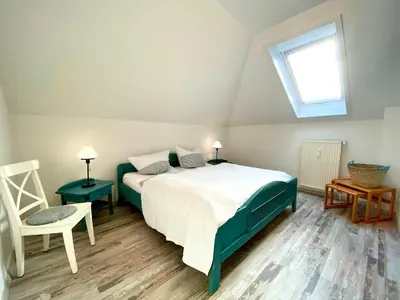 Ein Bett oder Betten in einem Zimmer der Unterkunft Hafenstraße 39 Wohnung 12