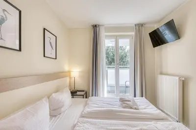 Ein Bett oder Betten in einem Zimmer der Unterkunft Strandnah Zingst - Ap 608
