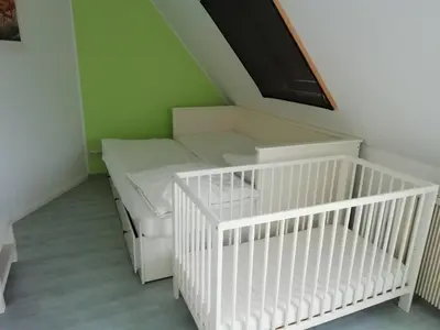 Ein Bett oder Betten in einem Zimmer der Unterkunft Gelbes Haus Pruchten - Ostseeurlaub bei Freunden