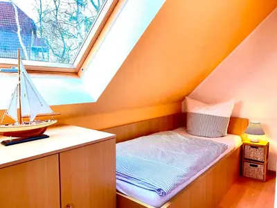 Ein Bett oder Betten in einem Zimmer der Unterkunft Am Deich 29