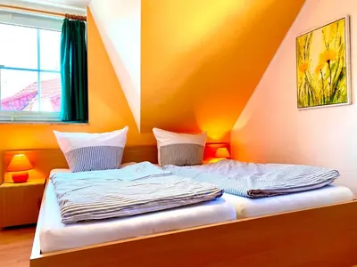 Ein Bett oder Betten in einem Zimmer der Unterkunft Am Deich 29
