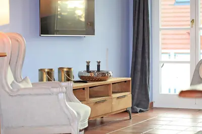 Ein Sitzbereich in der Unterkunft Ferienwohnung im Blauen Haus
