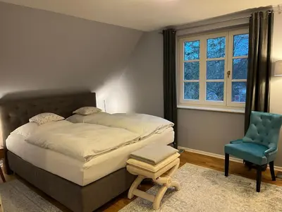 Ein Bett oder Betten in einem Zimmer der Unterkunft Ferienwohnung im Blauen Haus