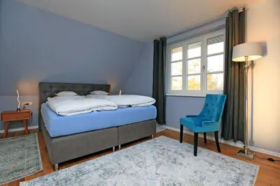 Ein Bett oder Betten in einem Zimmer der Unterkunft Ferienwohnung im Blauen Haus