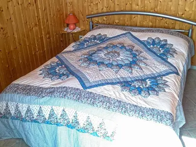 Ein Bett oder Betten in einem Zimmer der Unterkunft Bungalow am Waldrand